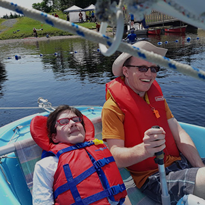 disabled young woman in sailboat smiling